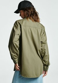 Next Užsagstoma palaidinė - khaki green
