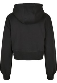 Sweat à capuche court noir avec manches longues, poignets et ourlet côtelés, et une grande capuche attachée, vu de dos sur fond blanc.
