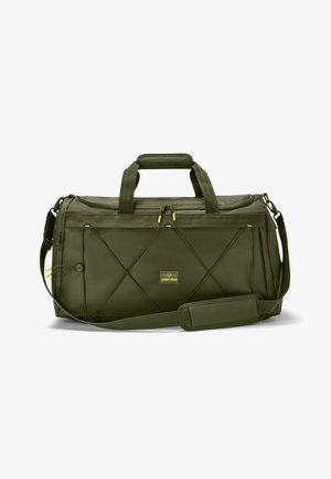 Oliwkowa torba typu duffel, wykonana z trwałego materiału, z podwójnymi uchwytami, regulowanym paskiem na ramię i żółtymi suwakami z pikowanym wzorem.