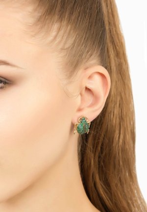Green beetle-shaped earrings with gold accents. Detailed texture and sparkling finish, designed to resemble an insect.