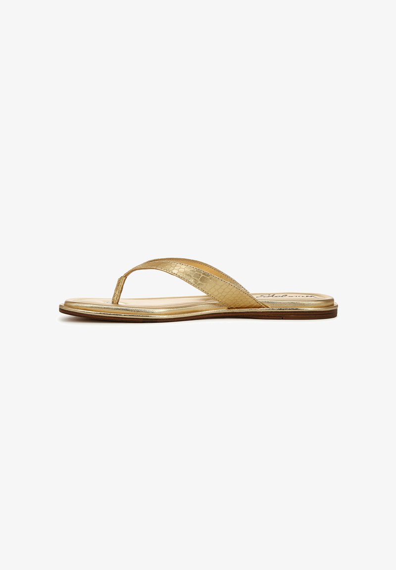Gold thong sandal with a textured metallic strap, flat sole, and soft footbed. Features a minimalist design with no additional embellishments.