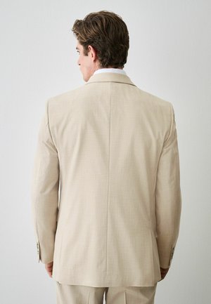 Next, REGULAR FIT - SLIM FIT MOTIONFLEX TEXTURED SUIT JACKET  . - Giacca - stone