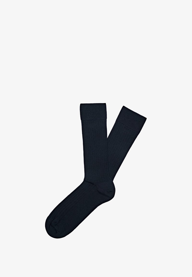 Mörk marinblå ribbade strumpor med en slät yta och en design i ankellängd. Har en förstärkt tå och ett bekvämt band upptill.