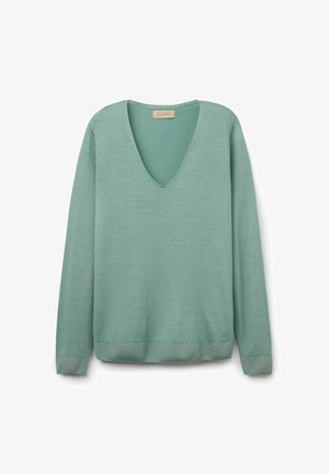 Ljust grön v-ringad tröja i mjukt material, med långa ärmar och ribbade manschetter och fåll. Enkel, minimalistisk design.