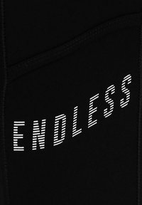 Endless CROSS POCKET - Leggings - black white