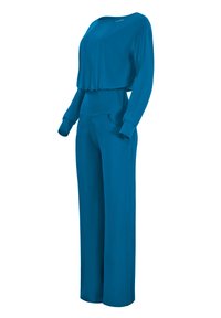 Jumpsuit blu, a maniche lunghe, con scollatura ampia, elastico in vita, tasche laterali e gambe morbide realizzate in tessuto liscio e elasticizzato.
