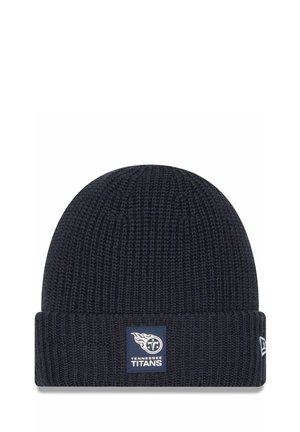 Beanie lavorato a maglia blu navy con risvolto. Presenta una patch rettangolare blu con il logo dei Tennessee Titans e il testo. Tessuto morbido.