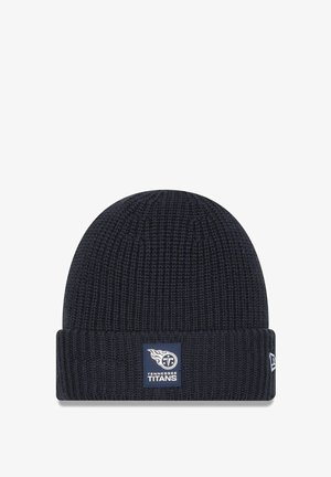 Navy knitted beanie with a folded cuff. Features a rectangular blue patch displaying the Tennessee Titans logo and text. Soft texture.