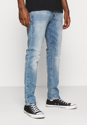 Jeans Tapered Fit - light-blue denim