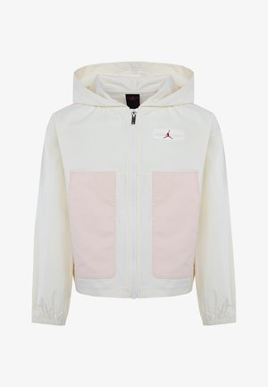 Giacca leggera con cappuccio in bianco sporco, dotata di tasche in tessuto rosa. Presenta una chiusura con zip completa e polsini elasticizzati. Dettaglio del logo ricamato.