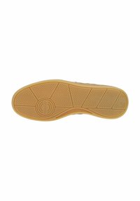 Beige Gummisohle mit einem strukturierten, Zickzackmuster und kreisförmigem Logo in der Mitte. Glatte Kanten und leichte Rillen für besseren Grip.