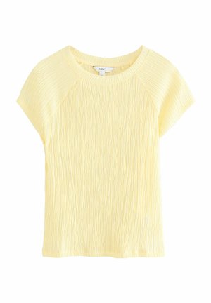 Haut jaune à manches courtes avec un tissu texturé à rayures horizontales et un col rond, conçu avec des manches raglan pour plus de confort.