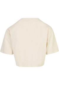 Skraćeni, kratki rukavi majica od off-white pamuka. Ima zaobljen izrez i glatku teksturu s jednostavnim, neukrasnim dizajnom.