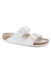 White sandals with two adjustable straps, made from synthetic material; feature a textured footbed and a cork sole. Subtle geometric pattern.
