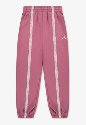Pantalon de jogging mauve avec taille et chevilles élastiques, bande de dentelle blanche sur chaque jambe et petit logo Jordan blanc sur le haut de la cuisse.