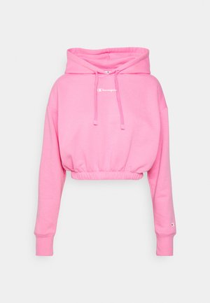Korte roze hoodie van zachte stof, met een trekkoordkap, geribde manchetten en een witte logo aan de voorkant.