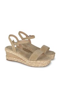 Beige suede wedge sandals with ankle straps and braided jute platform soles, featuring a small buckle closure.