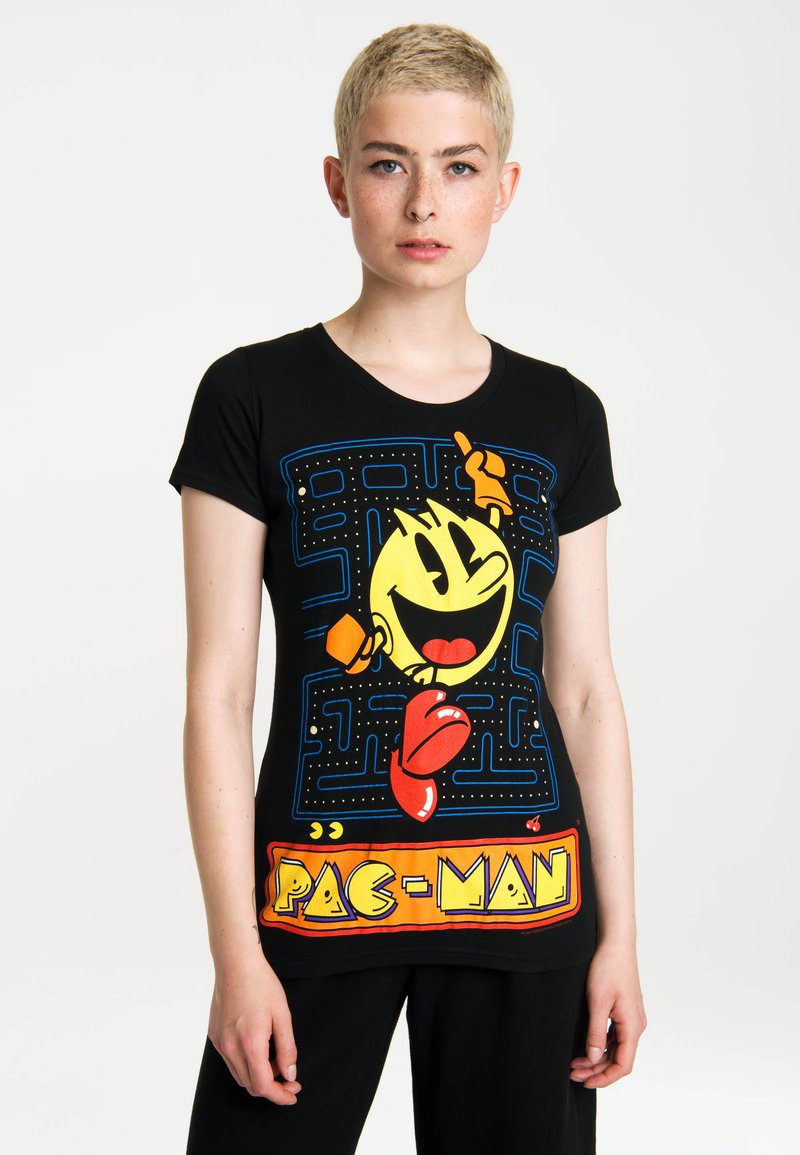 Black short-sleeve t-shirt featuring a colorful Pac-Man graphic with a maze design and bold "PAC-MAN" text at the bottom.