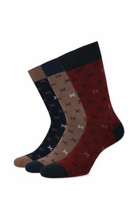 Trzy pary bawełnianych skarpetek w kolorach granatowym, brązowym i burgundowym z małym białym wzorem nożyczek, z prążkowanymi mankietami i wzmocnionymi piętami.