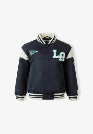 Navy blue varsity jacket with white stripes on sleeves, "LA" patch on chest, "WEST" pennant patch, striped collar, cuffs, and hem.