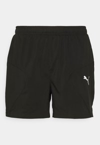 Svarte treningsshorts med elastisk belte, med sidelommer og en hvit Puma-logo på nederste venstre side. Glatt tekstur.