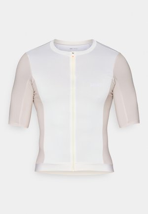 Maillot de cyclisme à manches courtes en blanc et beige clair, avec une fermeture éclair à l'avant, une texture lisse et un logo discret sur la poitrine.