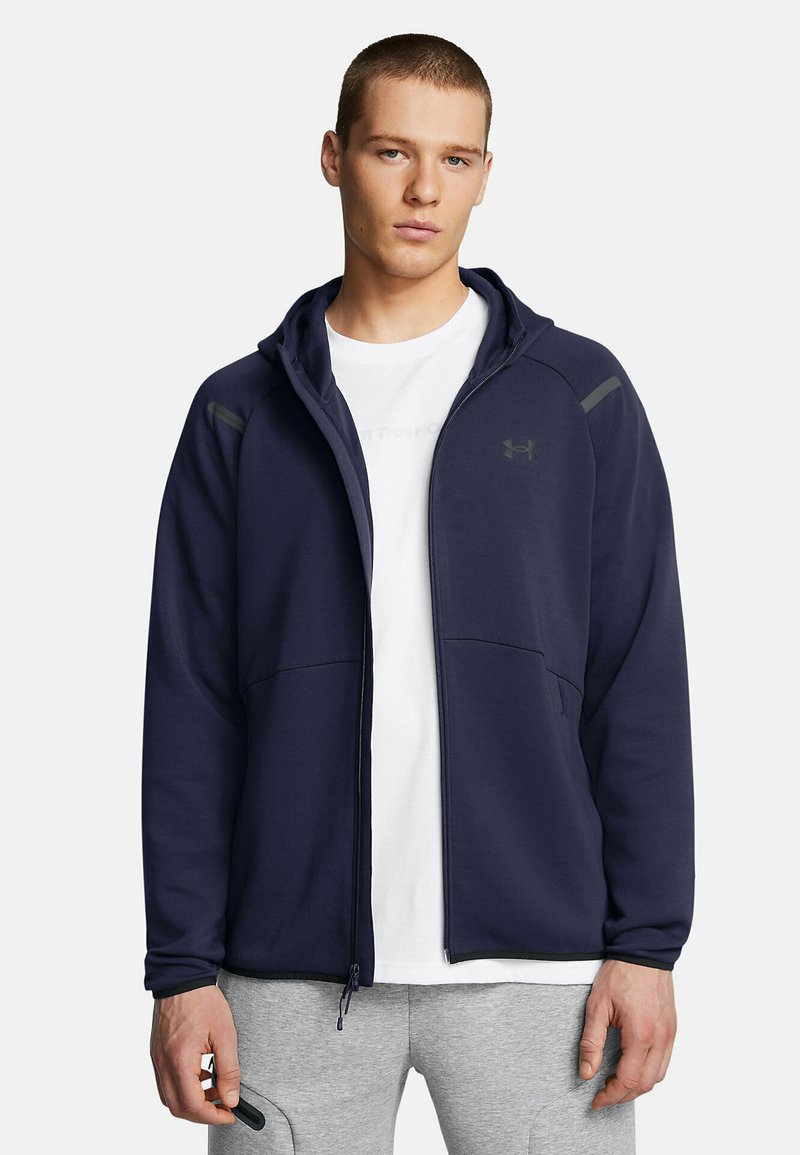 Navy zip-up hoodie made of soft fabric featuring a fitted design, contrasting gray accents, and two front pockets.