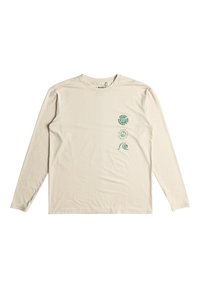 Langärmliges Hemd aus beigem Baumwollstoff, mit grünen grafischen Designs von drei kreisförmigen Mustern auf der linken Brust. Weicher Stoff, Rundhalskragen.