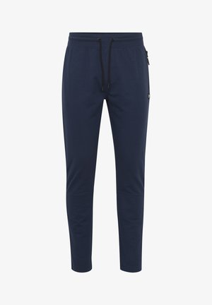 Marineblauwe joggingbroek met een trekkoord in de taille, zijzakken en taps toelopende pijpen; gemaakt van een zachte, rekbare stof.