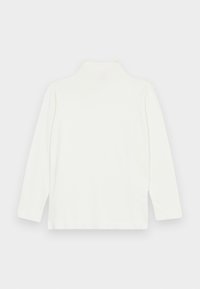 White long-sleeve turtleneck top with a smooth texture and relaxed fit, featuring a high neckline and straight hem. No visible patterns or accents.
