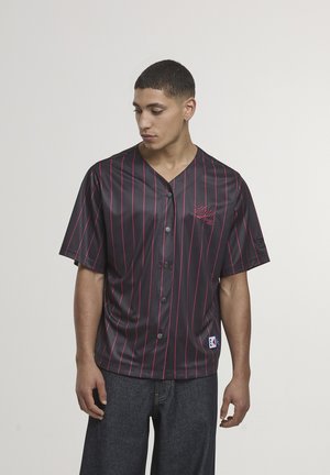 Short-sleeve black jersey with red vertical stripes, button closure, and logo detailing. Crafted from a smooth, shiny material.