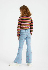 The New EMBROIDERY - Trapezaste traperice - light blue denim