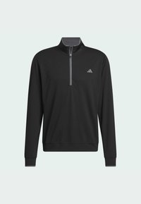 Sweatshirt noir zippé avec manches longues, en tissu lisse. Doté d'un col montant, d'un zipp avant et d'un petit logo gris sur la poitrine.