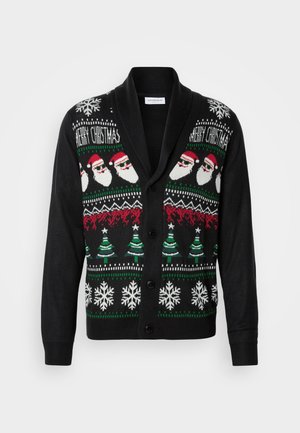 Cardigan noir avec un design festif comprenant des visages de Santa, des sapins de Noël et des flocons de neige dans des motifs en tricot blanc, rouge et vert.