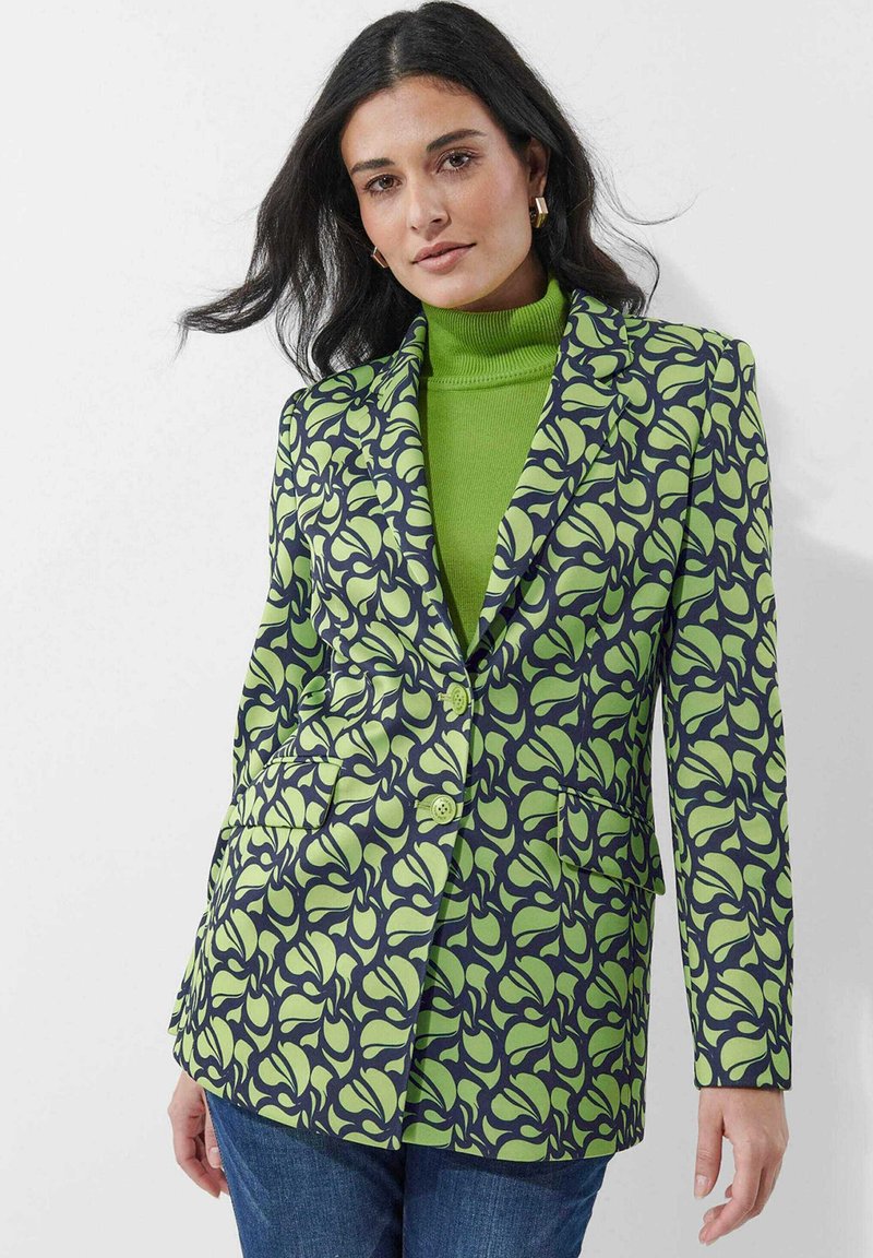 Gevoerd colbert met groene bloemenpatronen op een donkere marine achtergrond, met een voorzijde met twee knopen, revers en zijzakken.