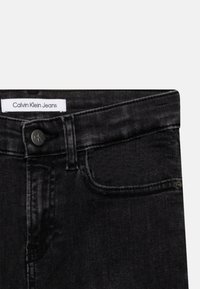 Calvin Klein Jeans SLIM WASHED - Vaqueros pitillo - black