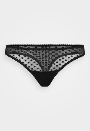 Zwarte kant met een hartjespatroon, golvende randen en een zachte achterkant voor comfort. Transparante mesh bovenkant met een solide onderkant.