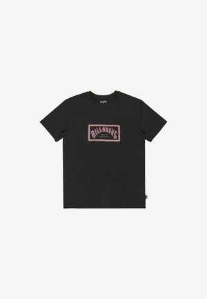 Black cotton t-shirt with a rectangular pink and white graphic featuring the word "BILLABONG" and decorative accents. Standard crew neck design.