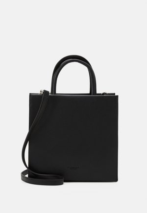 Black leather tote bag with two rounded handles and a detachable shoulder strap. Features a minimalistic design and a smooth texture.