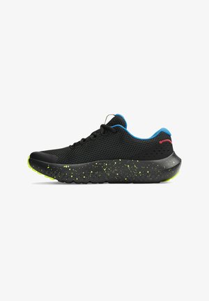 Black mesh running shoe with a textured black sole featuring green speckles, blue accent on the collar, and round black laces.