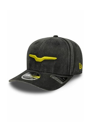 Black baseball cap with yellow stylized horn logo on front and yellow brand emblem on side, featuring stretch-snap adjustable fit.