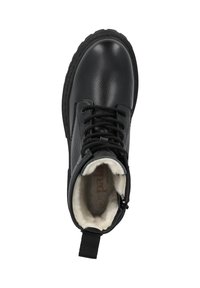 Bota de cuero negro con cordones, suela gruesa y forro de felpa blanca, vista desde arriba.