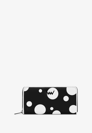 Black wallet featuring white polka dots, made of smooth material with a zip closure and a subtle logo accent on the front.