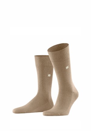 Calzini in cotone beige con risvolto a costine, texture liscia e un piccolo dettaglio del logo. Design alla caviglia adatto per un abbigliamento casual.