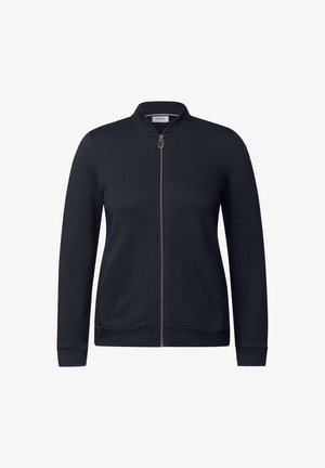 Veste noire zippée en tissu texturé, avec col et poignets côtelés, et poches latérales. Design simple et droit.