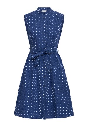 Varrukateta tumesinine kleit valgete täppidega, ees nööbitav, kõrge krae ja vööga, mis on vöökoht mänguliselt seotud.