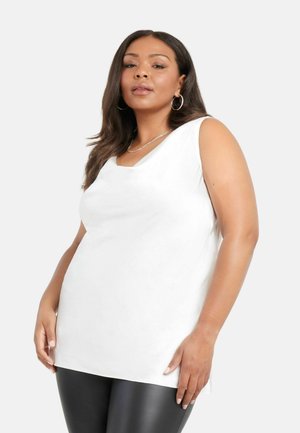 Top bianco senza maniche con scollatura a V, realizzato in un tessuto liscio. Abbinato a leggings neri, con un design semplice e moderno.
