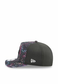 Black cap with a colorful splatter design on the visor, featuring a solid black panel, ventilation holes, and a small white logo.