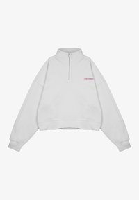 Sudadera corta blanca con medio cierre en la parte delantera, puños acanalados y logotipo bordado en rosa en el pecho. Material suave de mezcla de algodón.