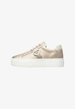 Metallic beige sneaker with a smooth texture, white platform sole, lace-up design, and silver heart-shaped hardware detail on the side.
